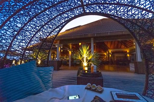 A bed which is outside covered with shelter