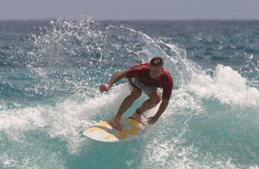 A man surfing on a surfboard